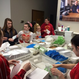 West Valley High School Cheerleaders helping stuff envelopes for the February 2014 Thanks Fairbanks mailer